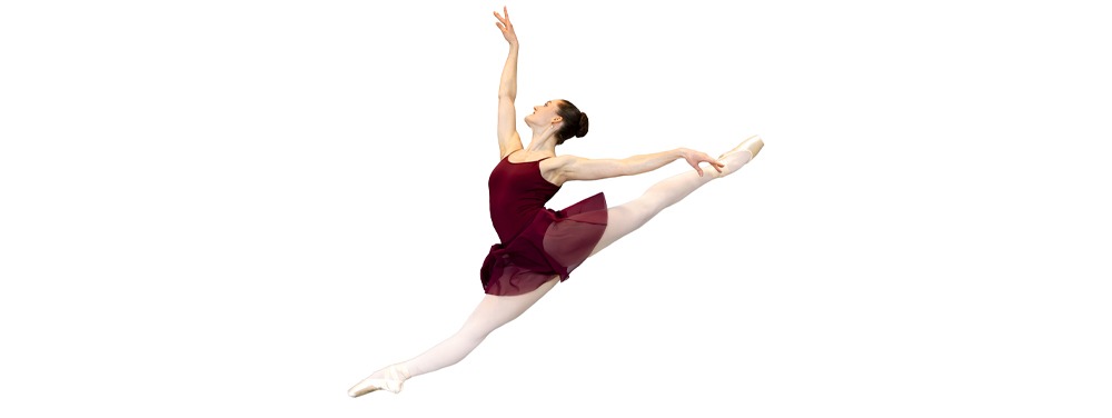 Ballet dancer in red jumping