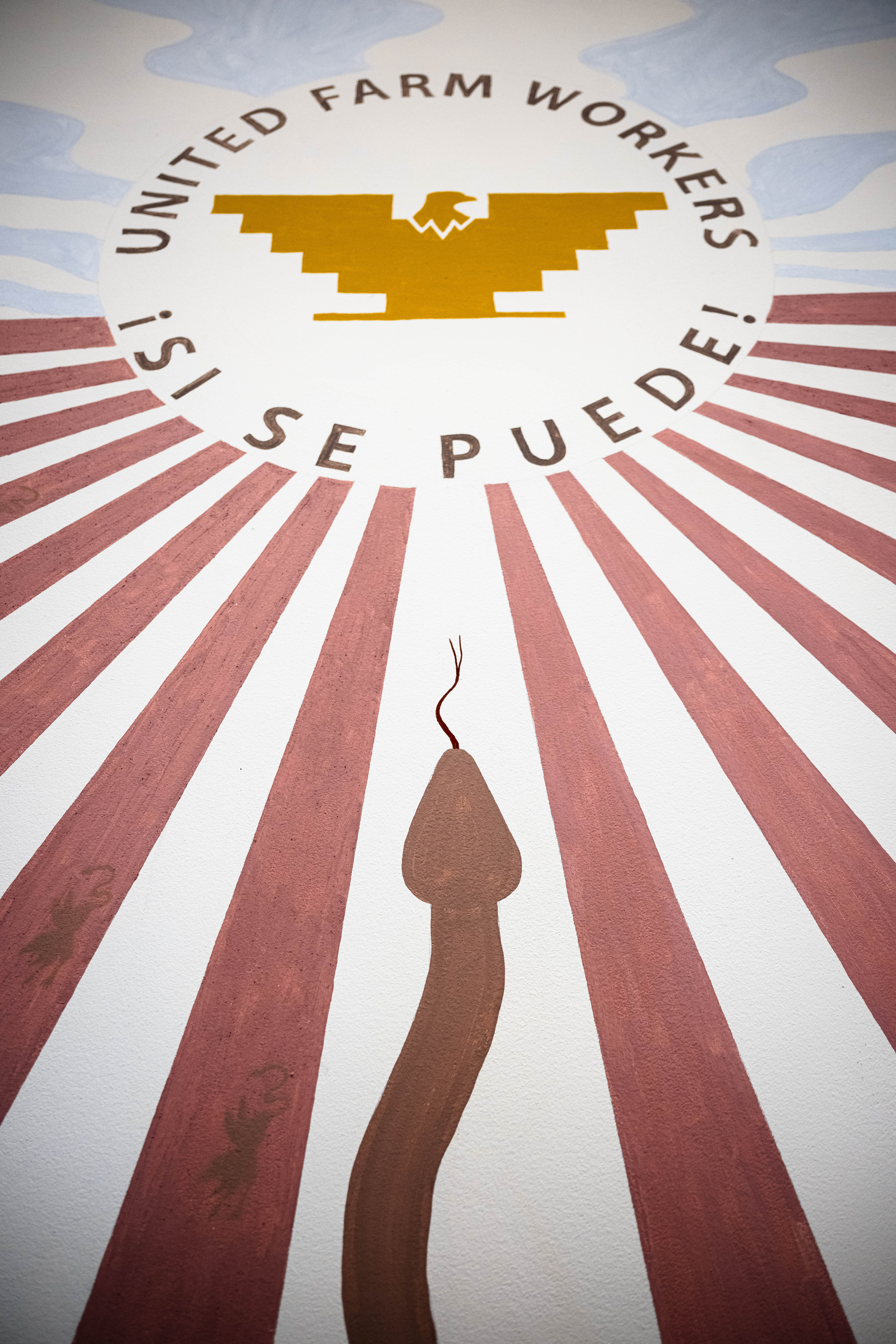 Part of Salvador Jimenez-Flores's mural featuring a snake and United Farm Workers logo