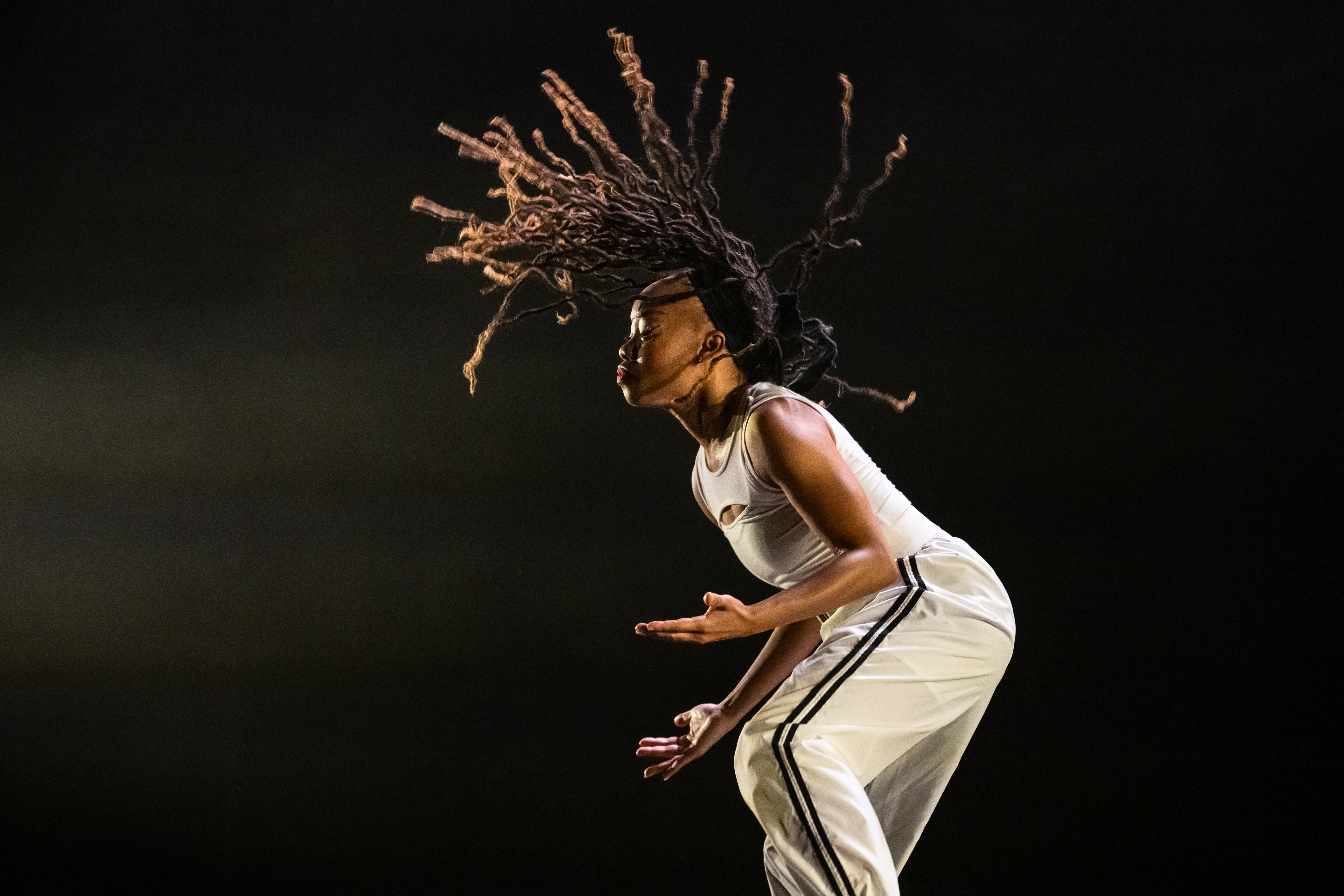Dancer on stage doing a hair flip