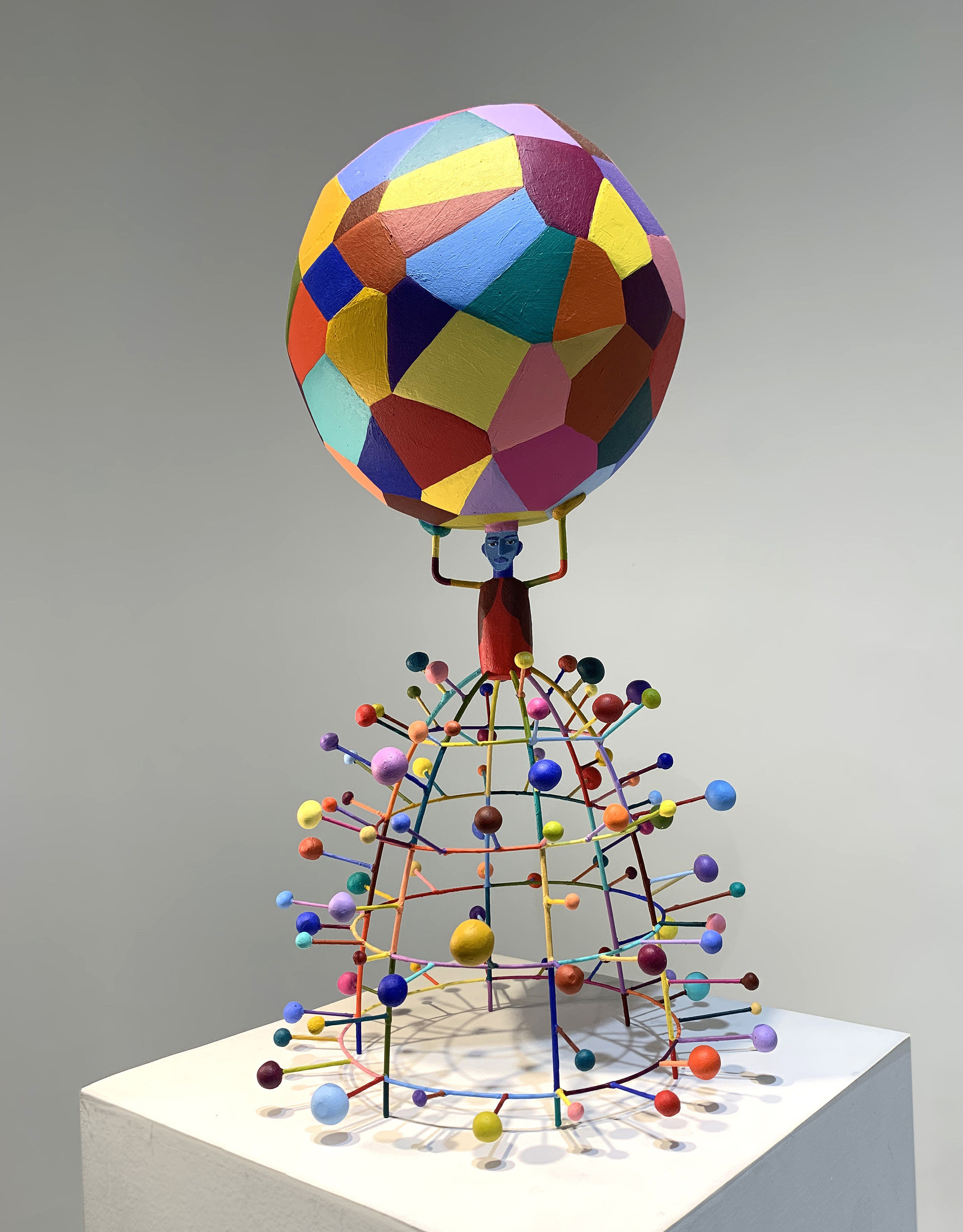 Tom Nussbaum sculpture of a man holding up the world