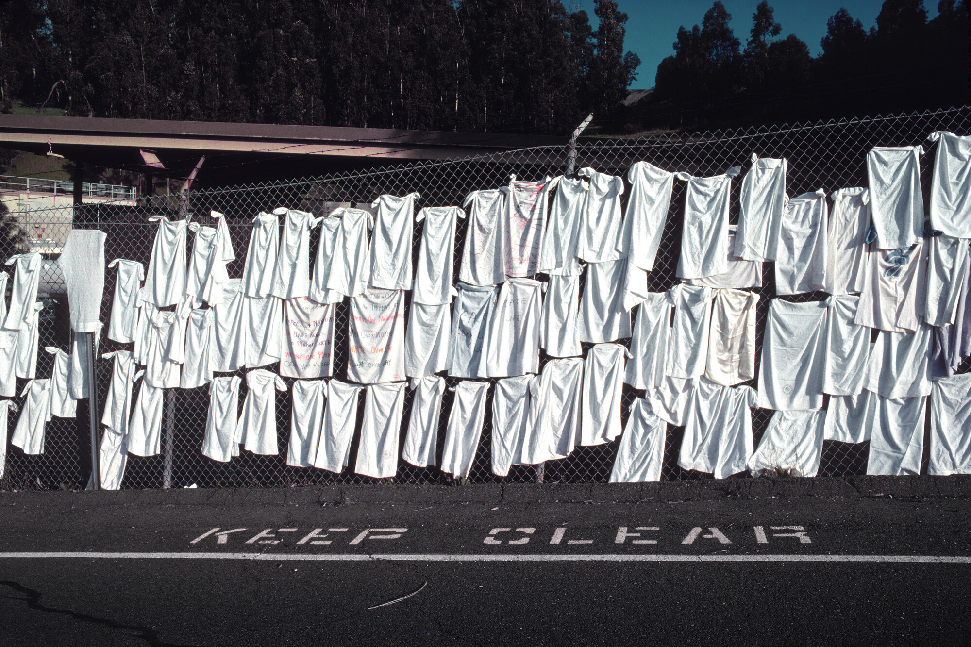 white tshirts on fence