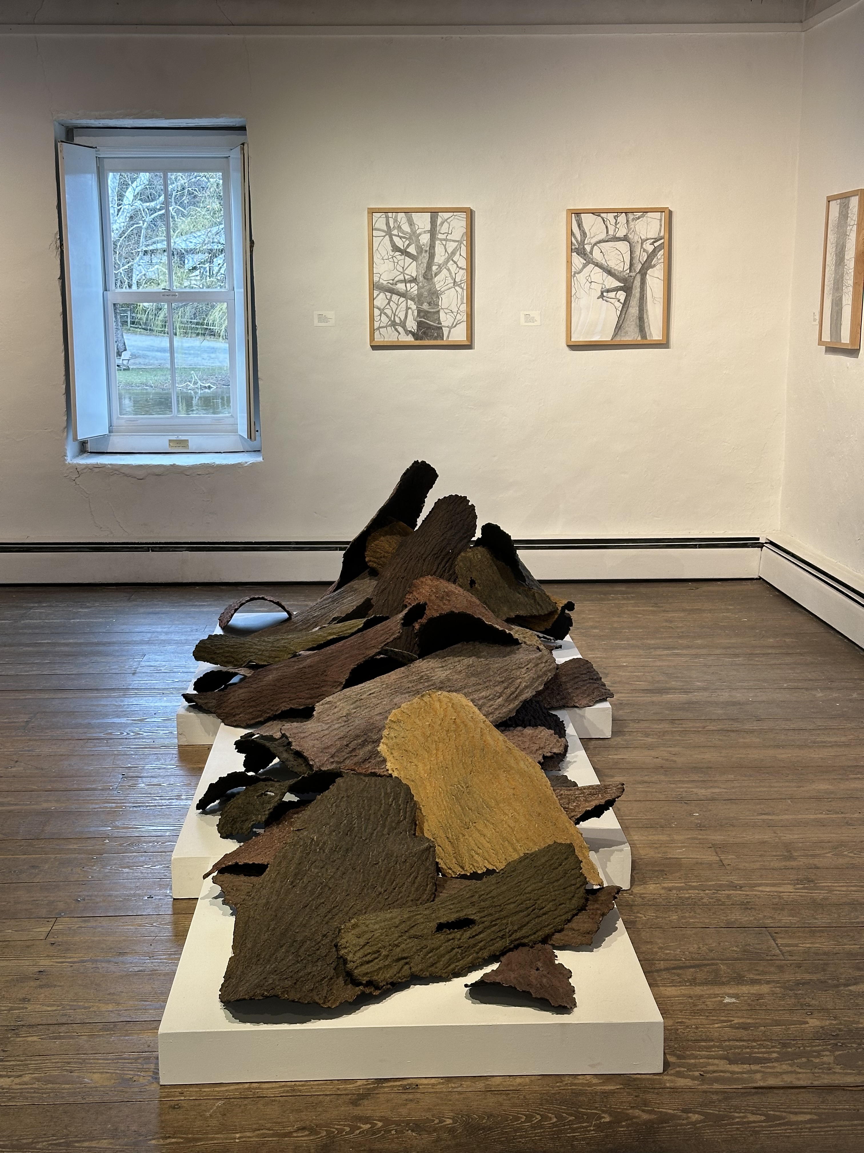sculpture of tree bark piled on top of each other