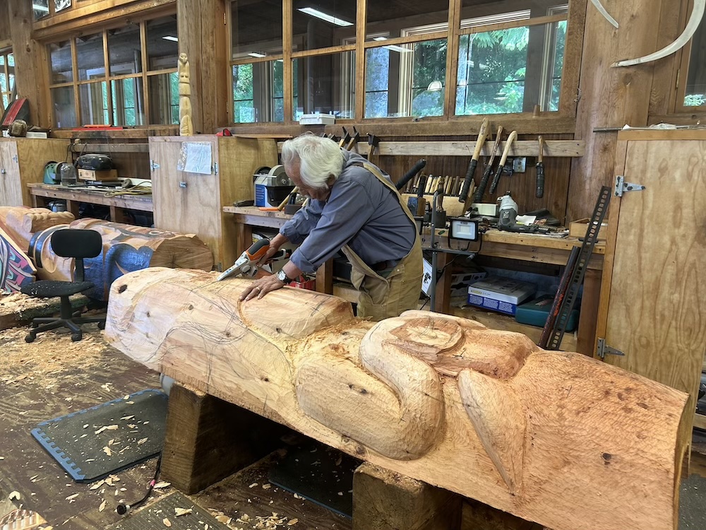 Nathan Jackson carving a totem in his studio