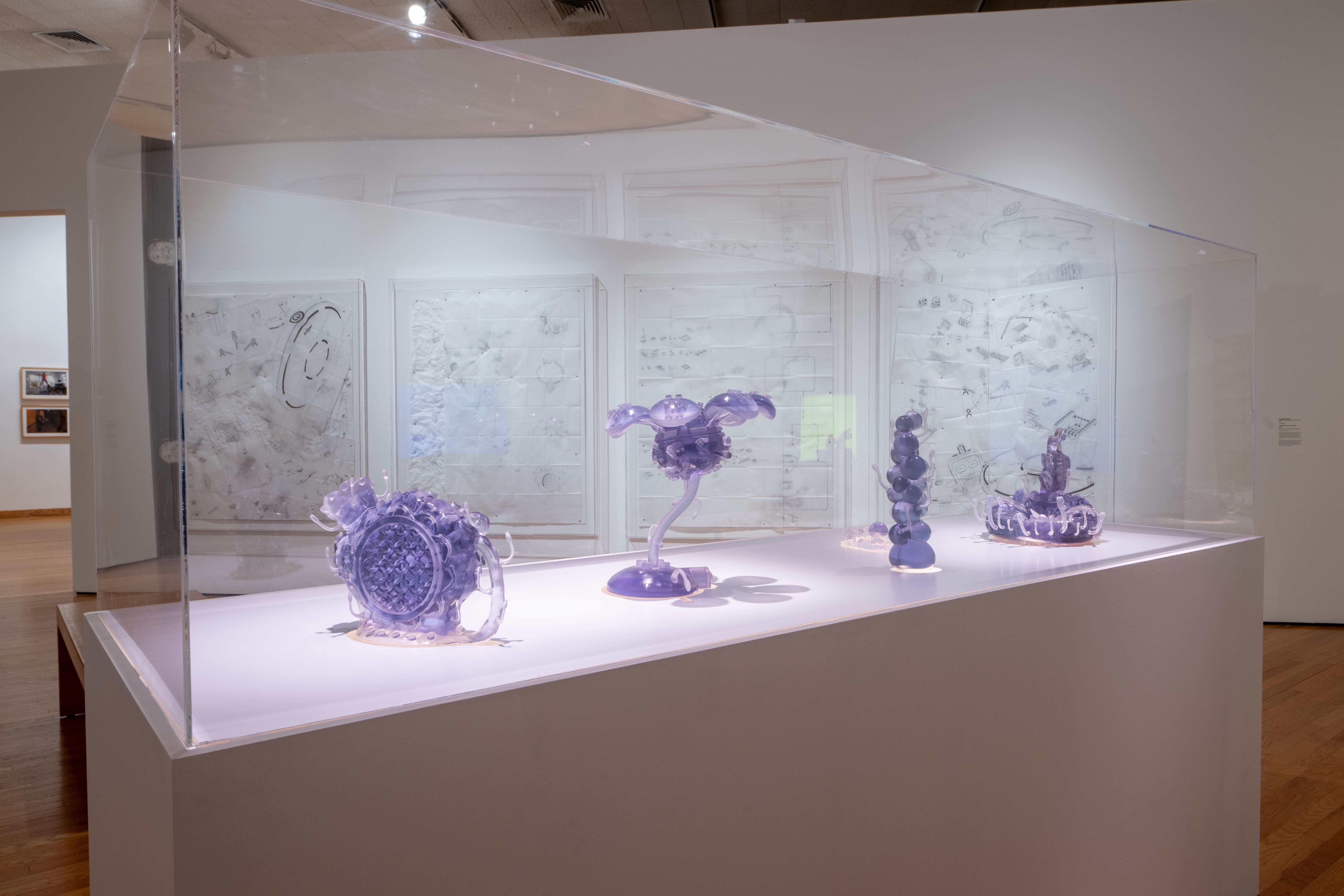 Purple glass sculptures encased in glass