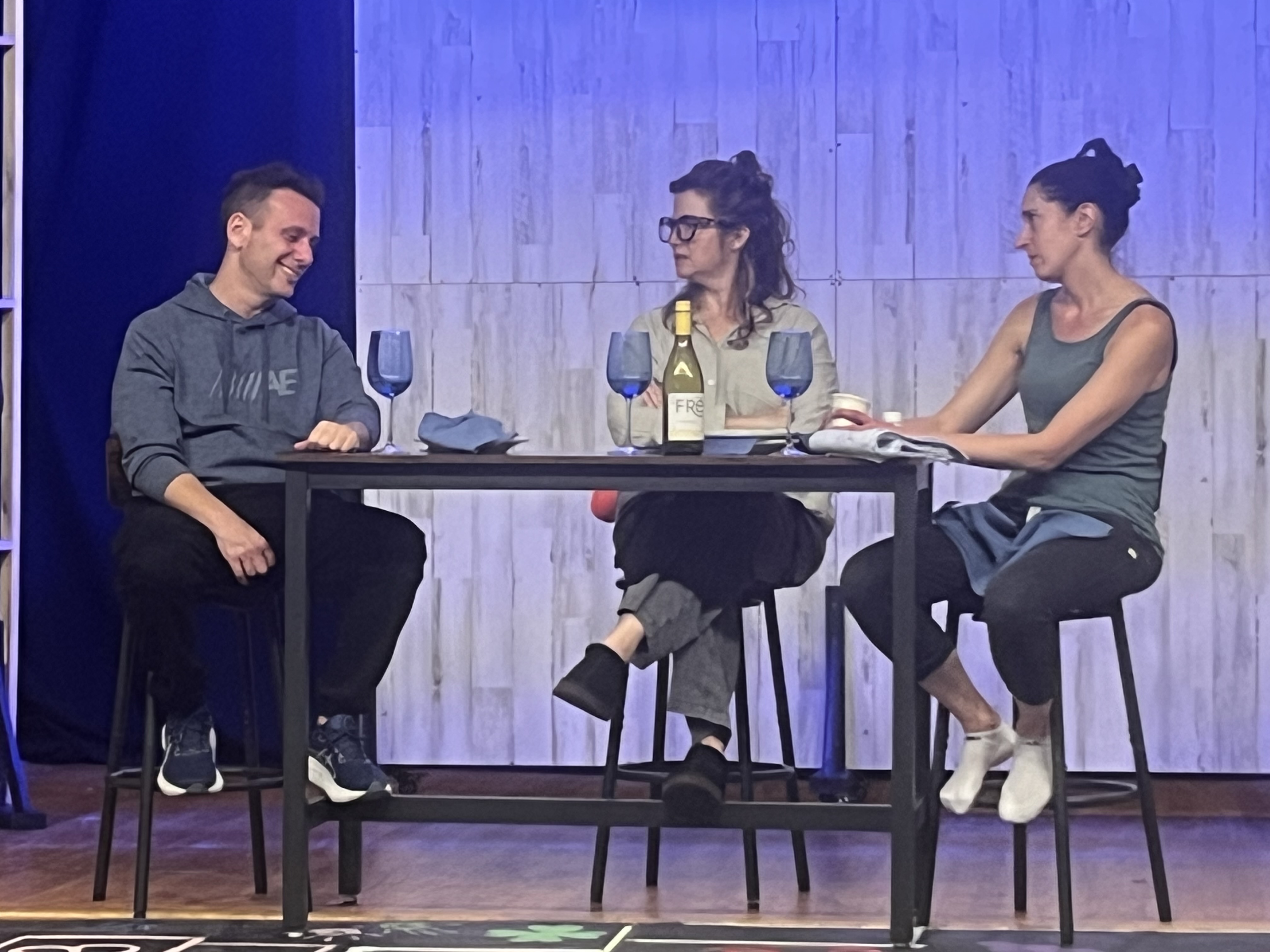 Dinner with Friends cast sitting at a table