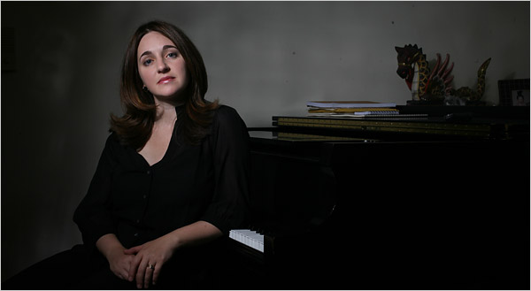 Simone Dinnerstein posing next to a piano