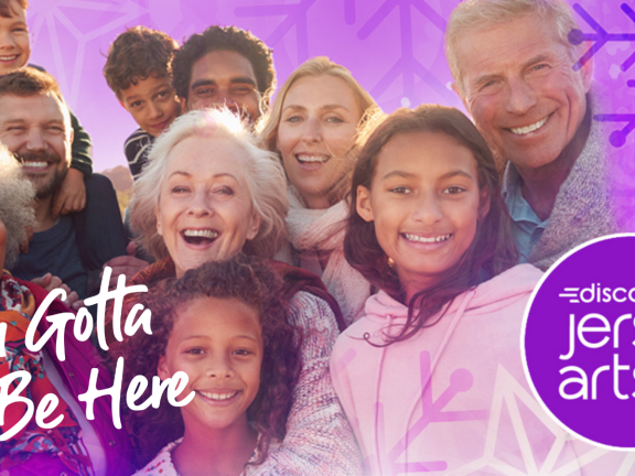 You Gotta Be Here slogan with a group of people and purple snowy decorations