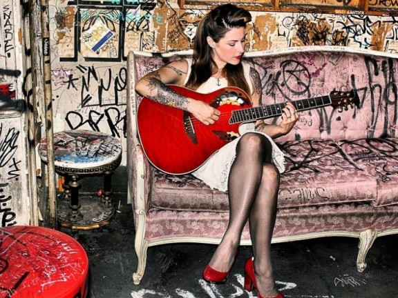 Ginger Coyle playing the guitar