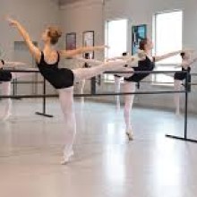 a group of ballerinas rehearsing