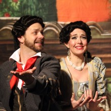 a duet between a Victorian man and a woman in the performance of The Barber of Seville