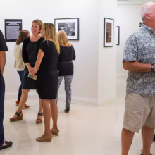 People viewing an exhibition at the Pollak Gallery