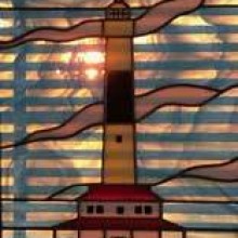 A depiction of a lighthouse made out of stained glass