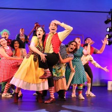 actors in kooky vintage costumes perform a musical number on stage in Seussical the Musical