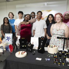 Youth Entrepreneurial Spirit (YES) students showcasing art they made and sold