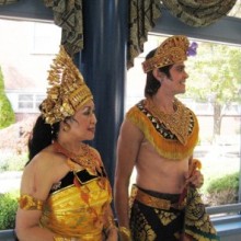 A man and a woman dressed in traditional Indonesian dance attire