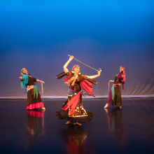 A group of dancers performing on stage