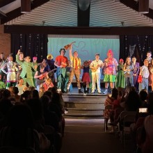 Actors from Moorestown Theatre Company on a stage