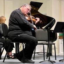 A man playing the violin