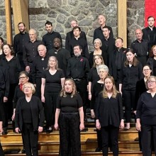 The Harmonium Choral Society performing in concert black attire