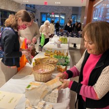 people shopping for tissues at an indoor market