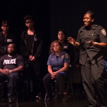 A group taking part in a creative writing, theater, and multi-media workshop