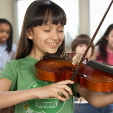 Young girl playing violin