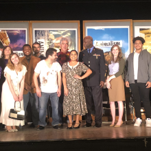 a photo of a play’s cast on stage