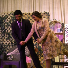a couple in fancy attire dancing