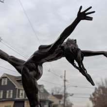 bronze sculpture of a ballerina called Ballerina by Barry Woods Johnston placed on the street of a town