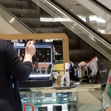 A woman goes to a mall kiosk to get her makeup done before a play