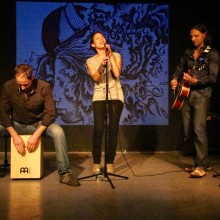 A small group performing on stage