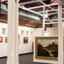 An art gallery with many paintings on display