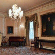 Interior of a gallery featuring a large painting