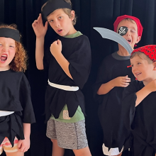 Some kids participating in a theatre camp dressed at pirates