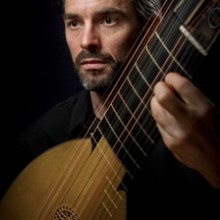 a close-up of a man playing an orbo