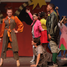 a cast of preteens performing a musical number from Legally Blond Jr onstage