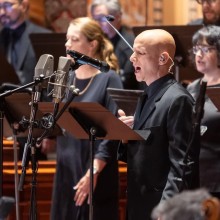 a close-up on a man singing a solo