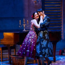 Two actresses in performance of "Two Sisters and A Piano".