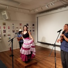 A small band performing in front of a crowd at the Puffin Cultural Forum
