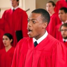Male soloist singing with a choir at Westminster College of the Arts.