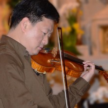 A man playing a violin.