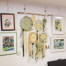 Gallery wall featuring a dreamcatcher.