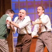 Three actors onstage.