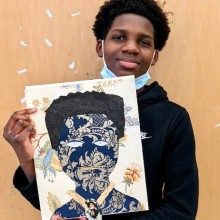 A young boy display his art creation at Visual Arts Center of New Jersey.