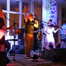 A band playing on stage at the Long Beach Island Foundation of the Arts & Sciences