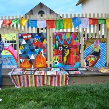 Woman standing in front of a display of artwork