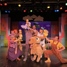 Group of actors performing with puppets
