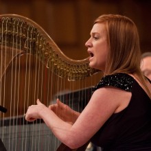 A woman playing the harp