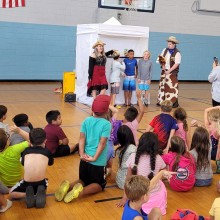 Children taking part in a workshop by the Riddlesbrood Touring Theater Company