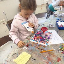 Child creates a craft project at West Windsor Arts Center.